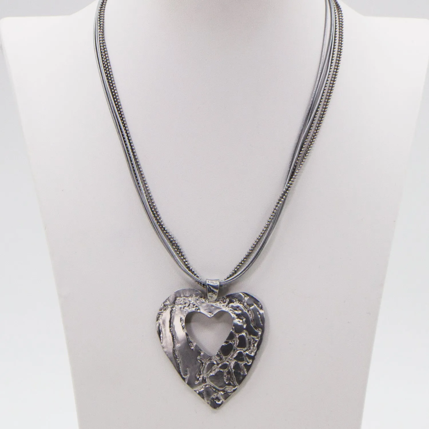 Contemporary cut out heart with leather & chain necklace