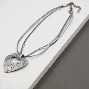 Contemporary cut out heart with leather & chain necklace