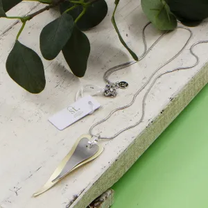 Contemporary elongated double heart long necklace