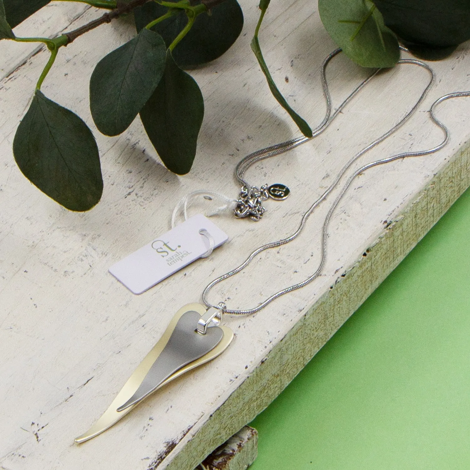 Contemporary elongated double heart long necklace