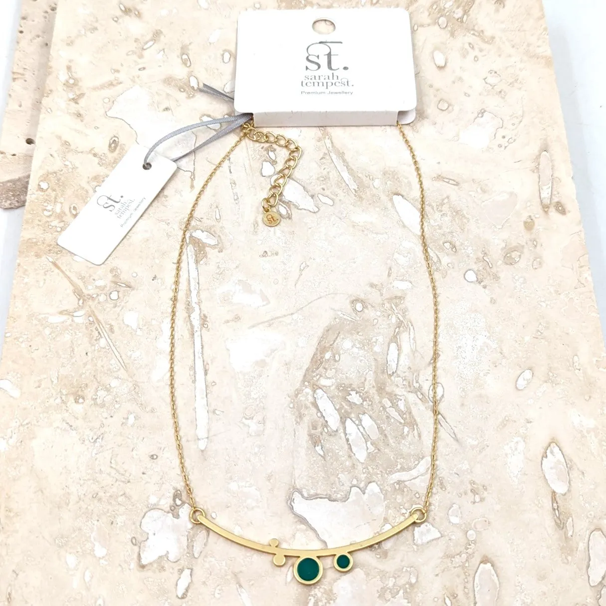 Contemporary enamel circles necklace on rounded bar